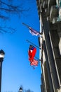 An American flag and two other red, white and blue flags flying from the side of a buildings in downtown Atlanta Royalty Free Stock Photo