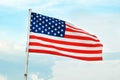 American Flag Wave CloseUp in blue sky background, United States Of America Flat Flags Royalty Free Stock Photo