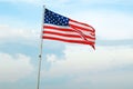 American Flag Wave CloseUp in blue sky background, United States Of America Flat Flags Royalty Free Stock Photo