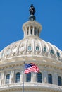 The American Flag waves in fron of the Capitol building in Washi Royalty Free Stock Photo