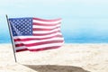American flag waving in the air on the beach Royalty Free Stock Photo