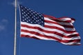 American Flag waving in deep blue skies Royalty Free Stock Photo