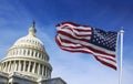 American flag waving with the US Capitol Hill Royalty Free Stock Photo