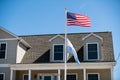 American flag waving in the wind in front of beach houses celebrating the 4th of July, Long Beach Island, NJ, LBI background Royalty Free Stock Photo