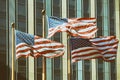 American flag wawing in front of building New york city Vintage filter effects. Royalty Free Stock Photo