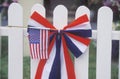 American Flag on White Picket Fence Royalty Free Stock Photo