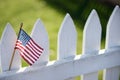 American Flag on white picket fence Royalty Free Stock Photo