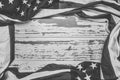 American flag on a white worn wooden background with copy space Royalty Free Stock Photo