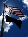American Flag on Windy Day Sunlight Blue Sky and Clouds Royalty Free Stock Photo