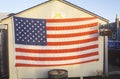 American Flag and Yellow Ribbon Hung on Shed