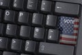 An American flagged VOTE key on a computer keyboard