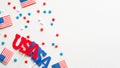 American flags, confetti stars and US decorations on white background. Flat lay, top view. Happy Independence Day, American Labor Royalty Free Stock Photo