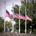 4 American flags at half-mast