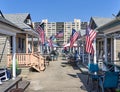 American flags hang from every bungalow near the boardwalk on Rockaway Beach
