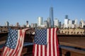 American Flags At 9/11 Memorial On Hudson River With View To Manhattan Skyline And Financial District