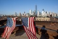 American Flags at 9/11 Memorial on Hudson River with view to Manhattan Skyline and Financial District Royalty Free Stock Photo