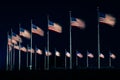 American flags at the Washington Monument at night, in Washington, DC Royalty Free Stock Photo