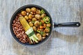 American food, corn, beans, potatoes, vegetables, frying pan, wooden, table, healthy, Dinner table concept, top view, copy space,
