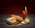 American food - hot dog, bloody mary with potato chips Royalty Free Stock Photo