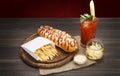 American food - hot dog, bloody mary with potato chips Royalty Free Stock Photo