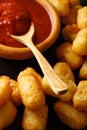 American food: tater tots and ketchup close-up. Vertical