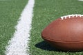 American football on artificial grass field Royalty Free Stock Photo