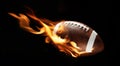 American football ball with bright flame flying on black.