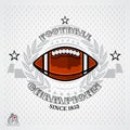 American football ball in center of silver wreath and ribbon on light background. Sport logo Royalty Free Stock Photo