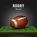 American football ball on field. Rugby black background Royalty Free Stock Photo