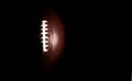 American football ball isolated on black background