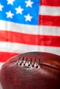 American football ball and old glory flag Royalty Free Stock Photo