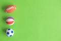 American football, basketball and soccer balls abstract isolated on green. Royalty Free Stock Photo