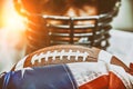 American football concept. The ball for the American football lies on the flag of America against the background of the