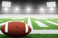 American Football on Field With Stadium Lights and Copy Space Royalty Free Stock Photo