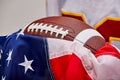 American football on American flag, old glory. Royalty Free Stock Photo