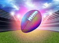 American Football flying in a glowing stadium background Royalty Free Stock Photo