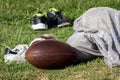 Football gear laying on practice field