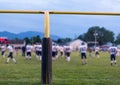 American football goal posts with blurred team Royalty Free Stock Photo