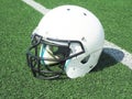 American Football helmet on field with yard lines Royalty Free Stock Photo