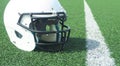 American Football helmet on field with yard lines Royalty Free Stock Photo