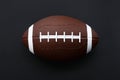 American football isolated on black background. Sport object concept Royalty Free Stock Photo