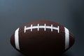American football isolated on black background. Sport object concept Royalty Free Stock Photo