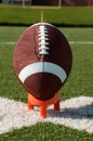 American Football on Kicking Tee Closeup Royalty Free Stock Photo