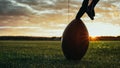 American Football Kickoff Game Start. Close-up Shot of an American Ball Standing on a Grass Field Royalty Free Stock Photo