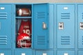 American football locker room with equipment, ball and helmet Royalty Free Stock Photo