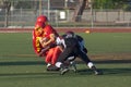 American Football Player Being Tackled During a Ga