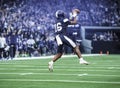 American Football Player catching a pass during a game. Royalty Free Stock Photo