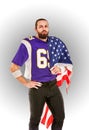 American football player closeup portrait. American football player with an american flag in his hands. Concept