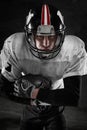American football player on dark background Royalty Free Stock Photo