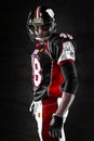 American football player on dark background Royalty Free Stock Photo